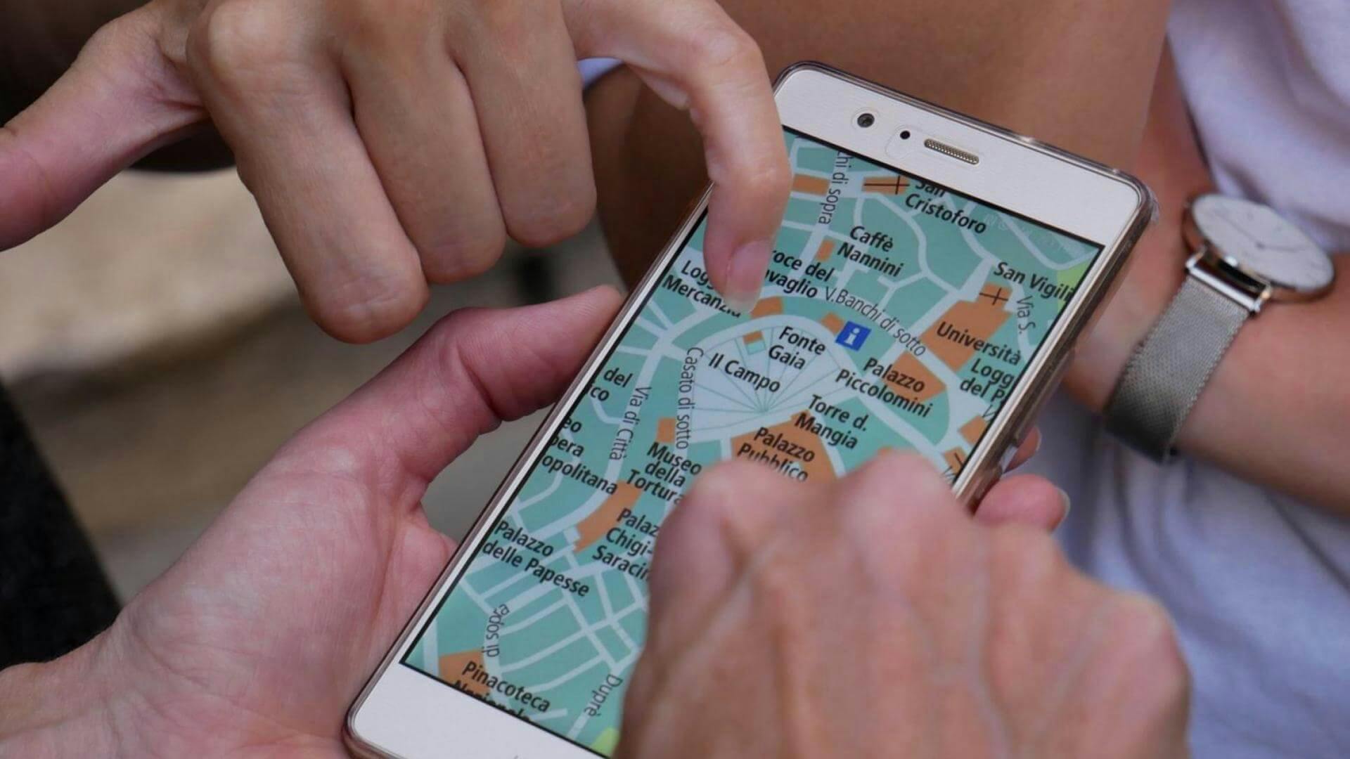 choosing coworking space location on smartphone Google maps